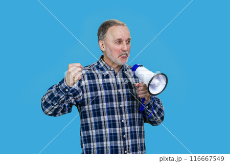 Portrait of aged mature man with megaphone. Isolated on blue. Portrait of aged mature man with megaphone. Isolated on blue. 116667549