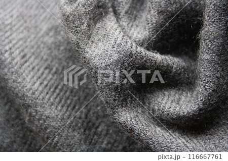 Knitted fabric in grey tones. Waved background. Knitted fabric in grey tones. Waved background. 116667761