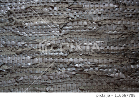 Braided with a mix of rustic materials in grey tones 116667789