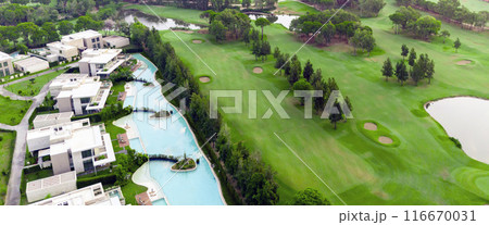 Aerial view of golf course and luxury villas in Belek, Turkey. Scenic panoramic view of golf fairway 116670031