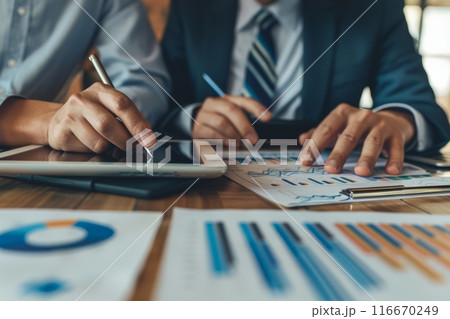 Two business people working together at meeting room Two business people working together at meeting room 116670249