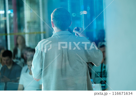 Speaker addressing audience at a business conference Speaker addressing audience at a business conference 116671634
