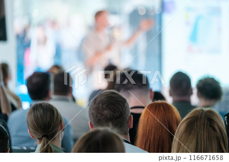Audience attending a speaker at business conference with presentation 116671658