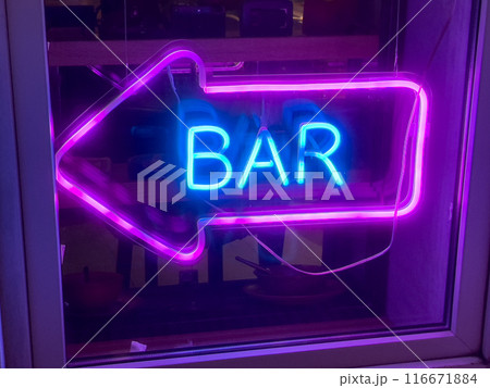 Neon bar sign with arrow in bright purple and blue colors Neon bar sign with arrow in bright purple and blue colors 116671884