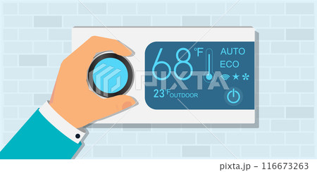 Hand regulates the smart thermostat controller in the house. 116673263