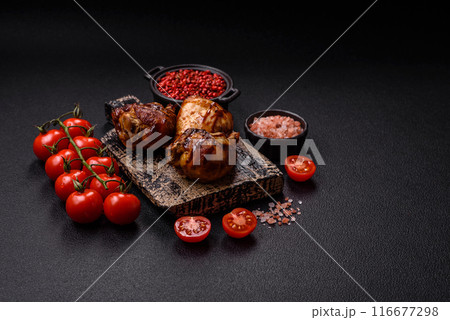 Delicious grilled chicken legs with spices and herbs 116677298