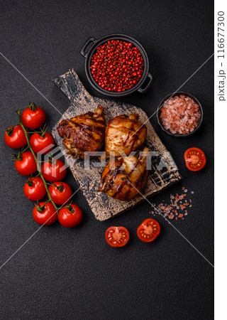 Delicious grilled chicken legs with spices and herbs 116677300