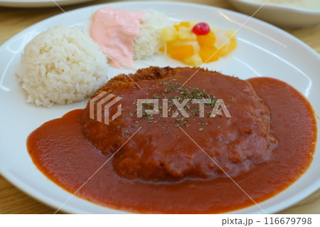 Pork cutlet with sauce and rice on white plate. Pork cutlet with sauce and rice on white plate. 116679798