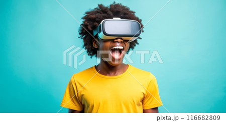 Teenager black boy experiencing virtual reality with joyful expression 116682809