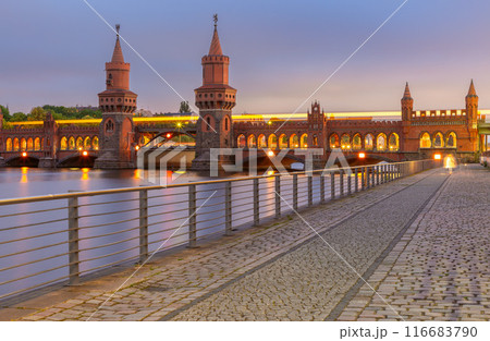 Old Berlin Oberbaum Bridge over the Spree River at sunset. 116683790