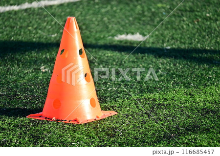 artificial green grass soccer field with orange training cones artificial green grass soccer field with orange training cones 116685457