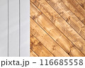 A portion of metal and wooden outdoor gate 116685558