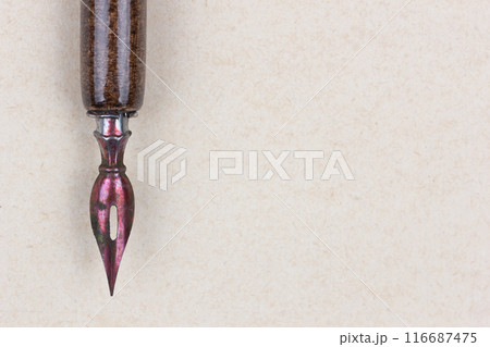 Fountain pen on an antique textured paper. Fountain pen on an antique textured paper. 116687475