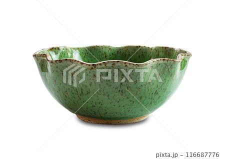 Side view closeup of empty curved edge round green ceramic bowl. 116687776