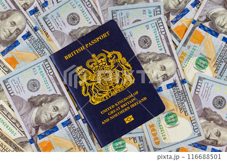 New biometric passport of United Kingdom with US currency notes represents transatlantic relationship between United Kingdom of Great Britain citizens New biometric passport of United Kingdom with US currency notes represents transatlantic relationship between United Kingdom of Great Britain citizens 116688501
