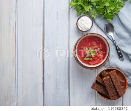 Ukrainian Russian borsch (beetroot soup) with meat in a black bowl  116688841