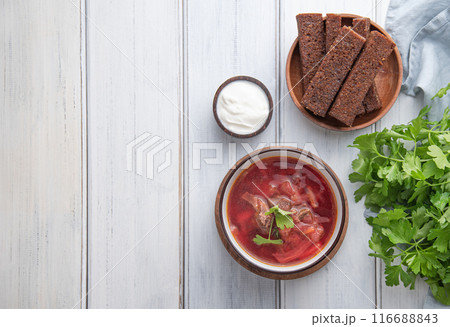 Traditional Ukrainian Russian borsch (beetroot soup) with meat in a black bowl  116688843