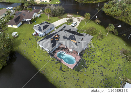 Flooded houses by hurricane Ian rainfall in Florida residential area. Consequences of natural disaster Flooded houses by hurricane Ian rainfall in Florida residential area. Consequences of natural disaster 116689358