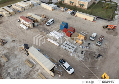 Construction site with building equipment on prepared ground in American suburbs. Aerial view of large development area of residential housing. Real estate market in the USA 116689431