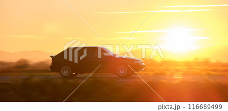 Car driving fast on intercity road at sunset. Highway traffic in evening Car driving fast on intercity road at sunset. Highway traffic in evening 116689499
