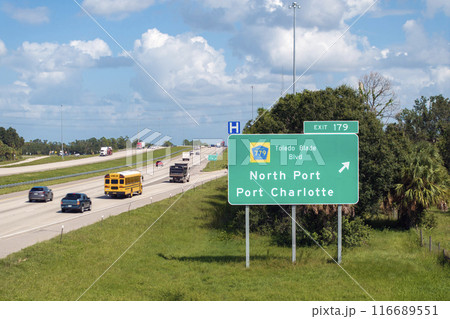 American interstate highway directional exit sign on fast motorway in Florida, USA. I-75 freeway junction leading to North Port and Port Charlotte 116689551