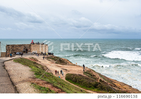 The lighthouse at the Fort of St. Michael the Archangel in Nazare, Portugal The lighthouse at the Fort of St. Michael the Archangel in Nazare, Portugal 116690138