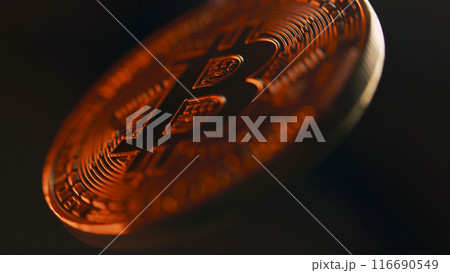 Close up of spinning golden bitcoin coin. BTC logo 116690549