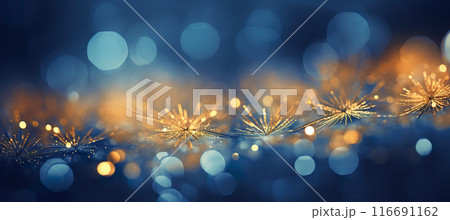 Cozy Christmas golden snowflakes on the snow background with yellow and blue bokeh hues. Festive, uplifting wallpaper backdrop 116691162