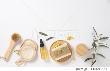 Flat lay beauty spa with natural cosmetic products peeling natural soap, sponges, oil Flat lay beauty spa with natural cosmetic products peeling natural soap, sponges, oil 116691644