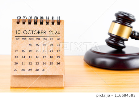 Desk calendar for October 2024 and judge's gavel. Desk calendar for October 2024 and judge's gavel. 116694395