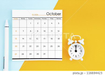 October 2024 Monthly calendar for 2024 year with pen on yellow and blue background. October 2024 Monthly calendar for 2024 year with pen on yellow and blue background. 116694423