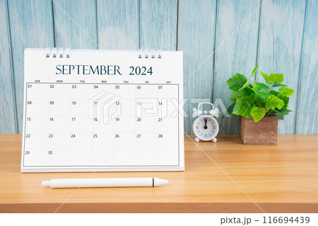 September Monthly desk calendar for 2024 year and alarm clock. September Monthly desk calendar for 2024 year and alarm clock. 116694439