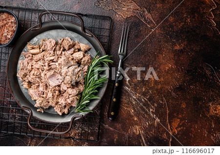 Canned tuna with fresh herbs ready for eat. Dark background. Top view. Copy space Canned tuna with fresh herbs ready for eat. Dark background. Top view. Copy space 116696017
