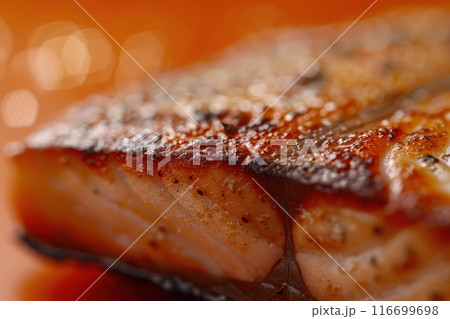 A piece of fish is cooked and has a brown crust with Generative AI 116699698