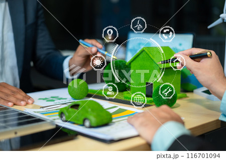 Two colleagues discussing data working and tablet, laptop with on Construction Site project, renewable and sustainable development, and solar panel concept. 116701094