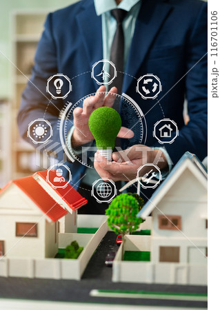 Two colleagues discussing data working and tablet, laptop with on Construction Site project, renewable and sustainable development, and solar panel concept. 116701106