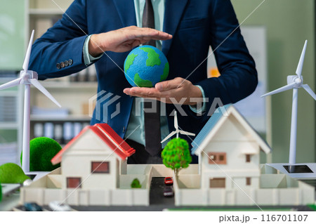 Two colleagues discussing data working and tablet, laptop with on Construction Site project, renewable and sustainable development, and solar panel concept. 116701107