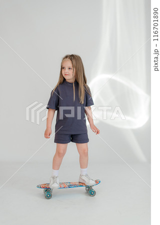 Little cute child kid baby girl 4-5 years old wearing light denim clothes isolated on wall background, children studio portrait. Mother's Day, love family, parenthood childhood concept 116701890