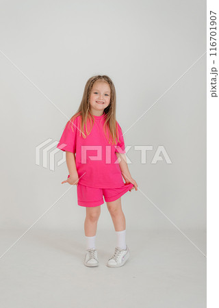 Little cute child kid baby girl 4-5 years old wearing light denim clothes isolated on wall background, children studio portrait. Mother's Day, love family, parenthood childhood concept 116701907