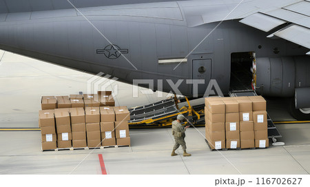 Packing military cargo at a military air base for shipment. Packing military cargo at a military air base for shipment. 116702627