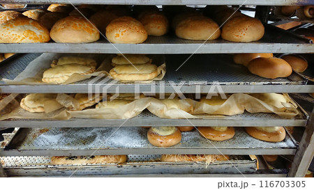 Freshly Baked Bread and Pastries on Cooling Rack 116703305