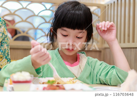 Cute little asian child girl eating food 116703648