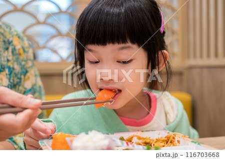 Cute little asian child girl eating food 116703668
