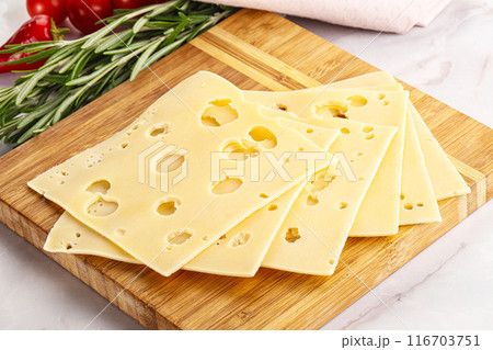 Sliced maasdam cheese with holes Sliced maasdam cheese with holes 116703751