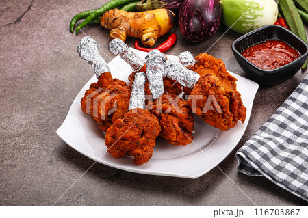 Indian cuisine glazed chicken lollipop Indian cuisine glazed chicken lollipop 116703867