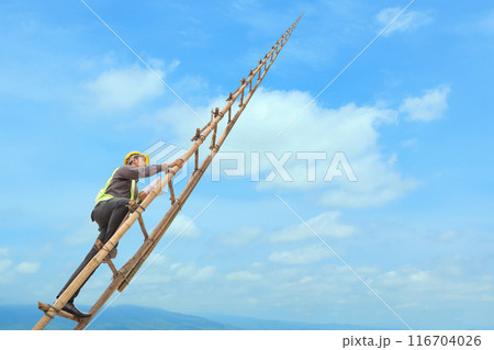 Asian business man engineer climbing up llong adder with blue sky, career growth and success concept 116704026