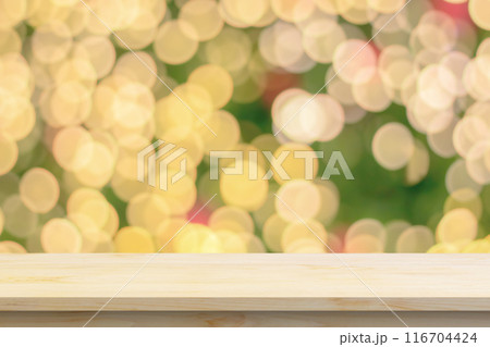 Empty wood table top with blur Christmas tree with bokeh light background 116704424