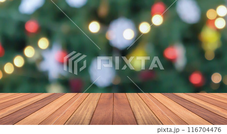 Empty wood table top with blur Christmas tree with bokeh light background Empty wood table top with blur Christmas tree with bokeh light background 116704476
