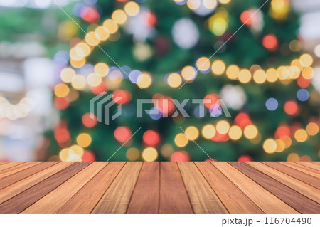 Empty wood table top with blur Christmas tree with bokeh light background 116704490