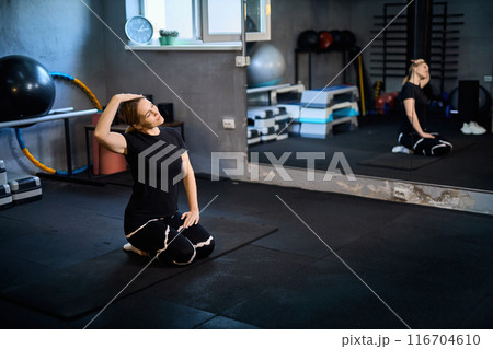 Young attractive sportive woman wearing activewear doing exercises at GYM, Young attractive sportive woman wearing activewear doing exercises at GYM, 116704610